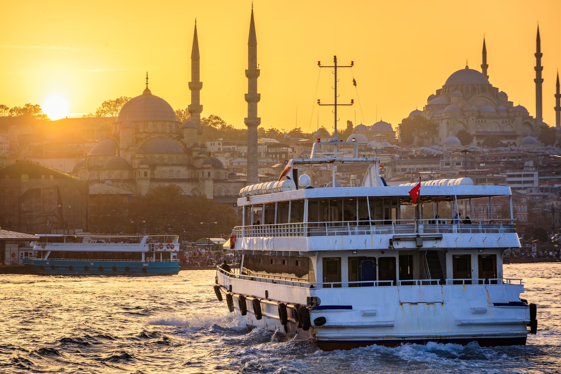 Sunset over Bosphorus with Yeni Cami and Suleymaniye Mosques, Istanbul, Turkey